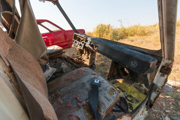 disassembled abandoned cars in poor condition