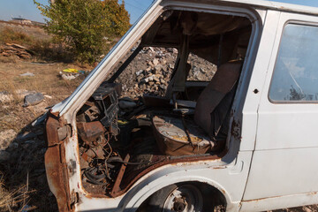 disassembled abandoned cars in poor condition