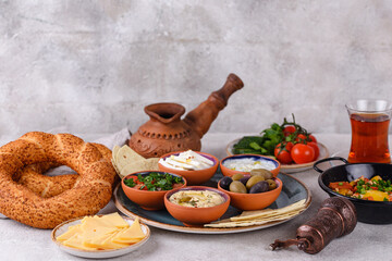 Traditional Turkish breakfast with meze and simit