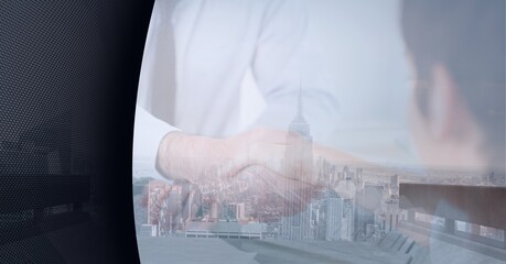 Mid section of businessmen shaking hands over cityscape against grey technology background