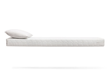 Studio shot of a mattress with a pillow floating in air