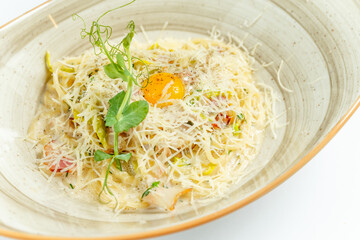 beautiful bright juicy Italian dish with cheese, egg, tomato and herbs in a plate on a light background, close-up, restaurant serving