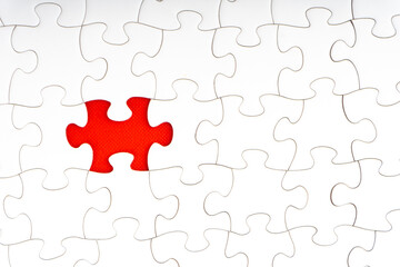 Red jigsaw puzzle pieces on red background. Copy space and business concept