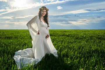 Pregnant woman in white dress