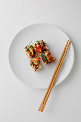 Japanese food: maki and nigiri sushi set. Sushi rolls with rice, fish salmon, smoked eel, avocado,...