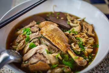 Top view Duck noodle on a white bowl,One of the menu of Thai street street noodles