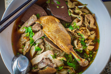 Top view Duck noodle on a white bowl,One of the menu of Thai street street noodles