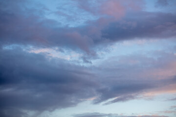 Rain clouds in the sky at sunset