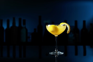 Cocktail Sidecar on a black table in a bar.