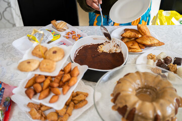 Eid dessert table with a selection of traditional snacks and cake