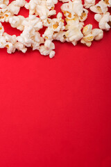 Heap of delicious popcorn isolated on background. Scattered popcorn texture background. Selective focus.