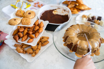 Eid dessert table with a selection of traditional snacks and cake
