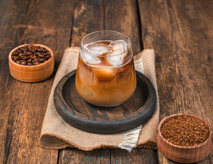 Iced coffee on a wooden background. A refreshing, invigorating drink.