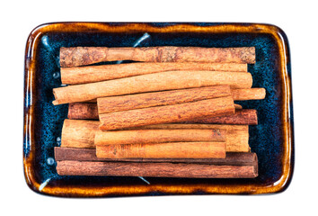 heap of chinese cinnamon (Cassia) in bowl cutout