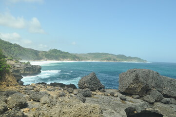 Beautiful scenery on Kedung Tumpang beach with large rocks, Pucanglaban District, Tulungagung Regency, East Java