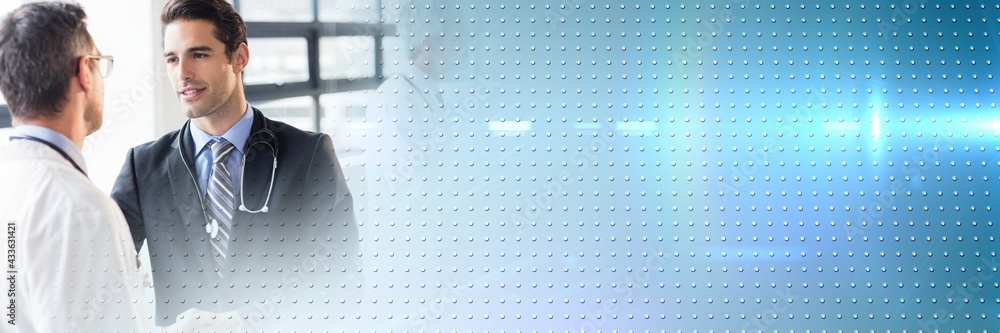 Poster composition of glowing rows of dots over doctors in background