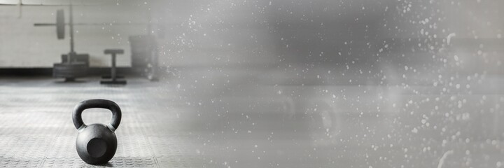 Composition of kettlebell on gym floor with blurred grey light