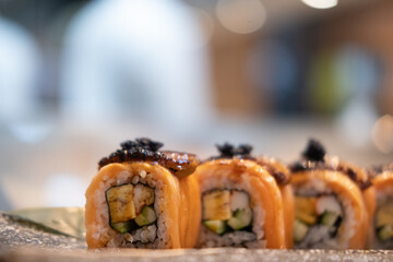 Japanese salmon sushi roll topped with foie gras