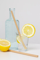Lemon water with bamboo straw. Healthy detox drink. Reusable bamboo straws as an alternative for single-use plastic straws, healthy and sustainable lifestyle concept