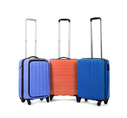 Stylish suitcases packed for travel on white background