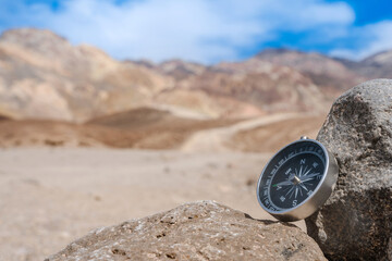 Compass on salt rocks in Death Valley, USA. Tourism concept