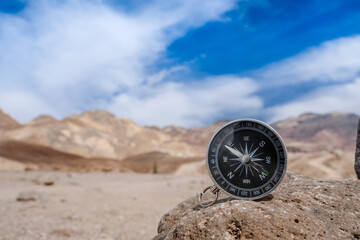 Compass on salt rocks in Death Valley, USA. Tourism concept