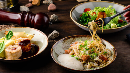 Italian spaghetti on rustic wooden table. Mediterranean cuisine with pasta