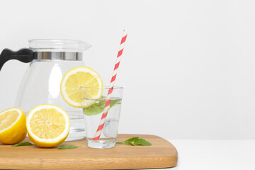 Lemonwater with colorful paper straw. Healthy detox drink. 