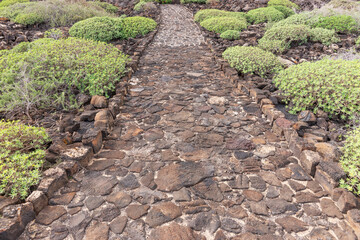 Empty footpath made of volcanic stones