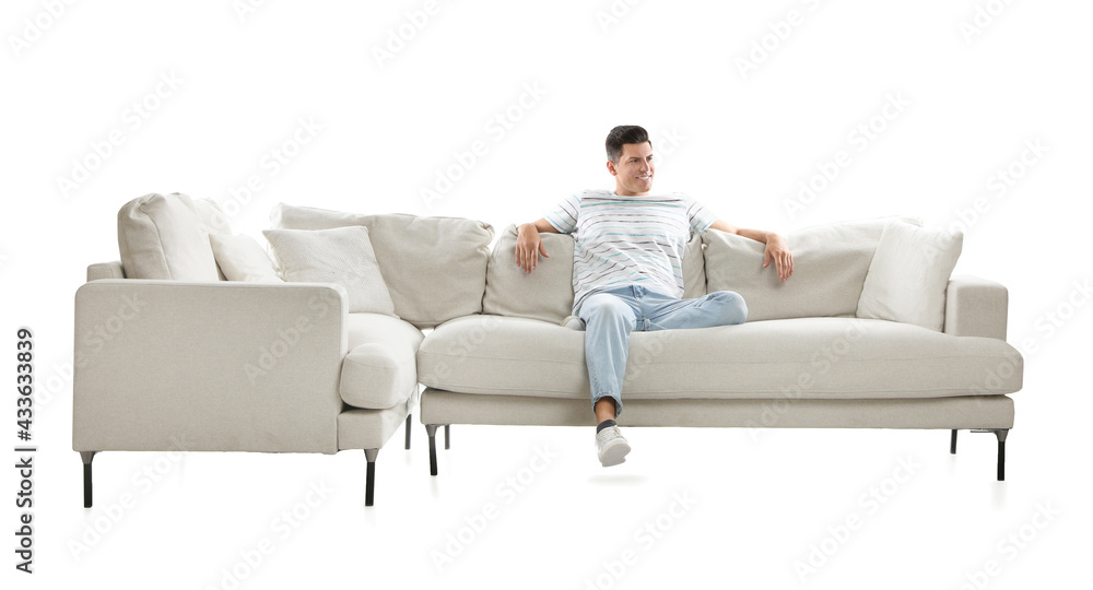 Poster Man relaxing on comfortable sofa against white background