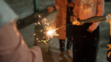 Blurry of children having fun playing fireworks
