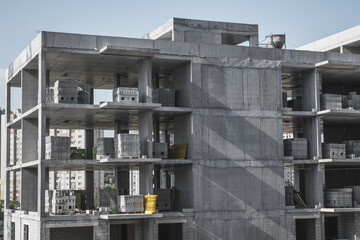 Atasehir, Istanbul - May 2021: Reinforced concrete apartment construction. Earthquake resistant building construction. Concrete pillars, brick walls, building materials.
