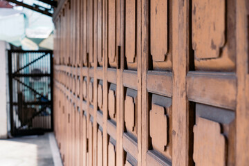 Classic backdrop wood wall and door in front of Thailand vintage traditional Building.