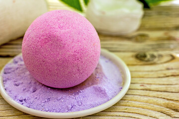 Salt pink bath bomb with lavender close-up. Natural cosmetics handmade background