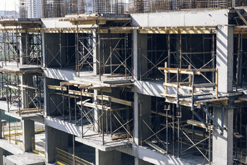 Atasehir, Istanbul - May 2021: Reinforced concrete apartment construction. Earthquake resistant building construction. Concrete pillars, brick walls, building materials.