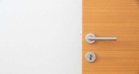 wooden door and metal door handle. Front view