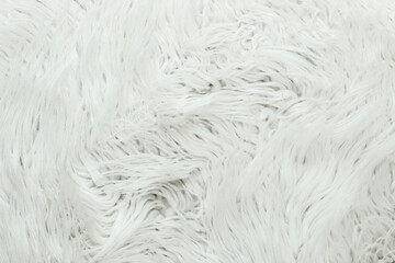 White fur artificial texture. Soft and delicate background for designers.
