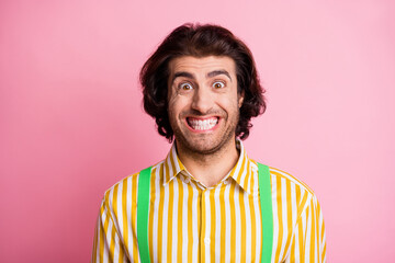 Portrait of young handsome ecstatic delighted cheerful positive good mood happy man smiling isolated on pink color background