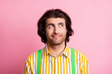 Portrait of young handsome dreamy smiling cheerful man look copyspace wear suspenders isolated on...