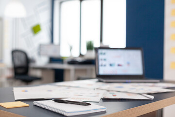 interior of creative office for new financial business, start up company. Brainstorm area in business center with nobody in it, shot of empty room with modern furniture and blue wall.