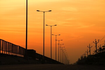 Fototapeta na wymiar Morning View, Sunrise in the morning, Street light pattern on the bridge