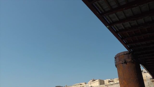 Sailing under metal bridge in Malta.