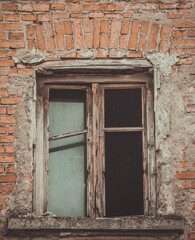 Fototapeta na wymiar old window in old brick wall