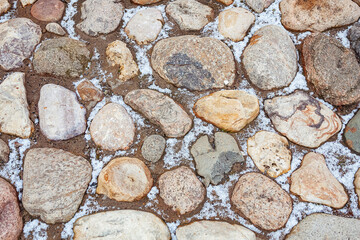 old stone tile path with snow