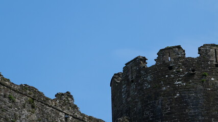 Blue sky above an old stone castle wall © Chlo&Sam Photography
