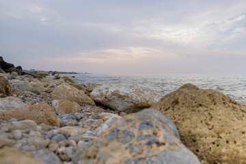 Fototapeta na wymiar Magical sunset background natural colours crashing wave Cyprus landscape beach sea stone . High quality photo