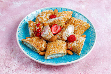 Crepes filled with cottage cheese for breakfast.