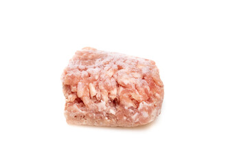 Frozen medium ground pork. Small portioned out ground lean pork meat for a single serving meal. Concept for budget wise cooking, buying and storing larger food amounts. Isolated on white.