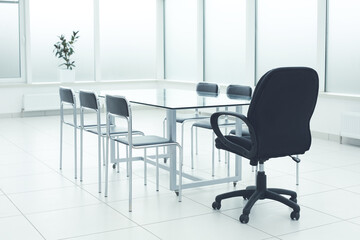 The bright workspace of a large company. Bright white spacious studio. Coworking