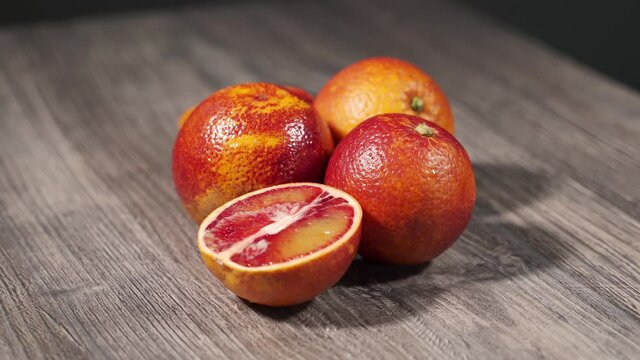 red sicilian oranges on a wooden table
